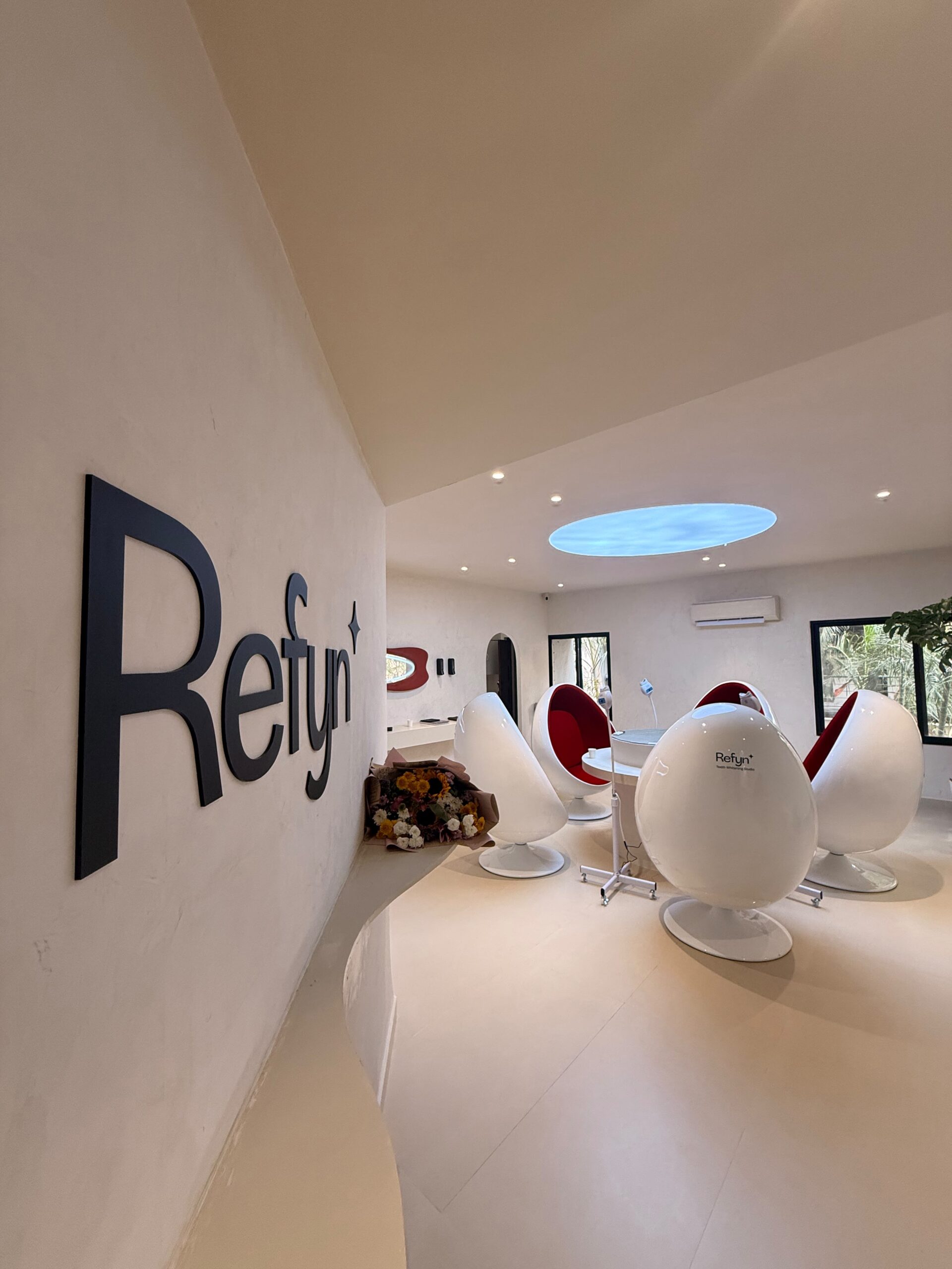 Bright confident smile after teeth whitening at Refyn